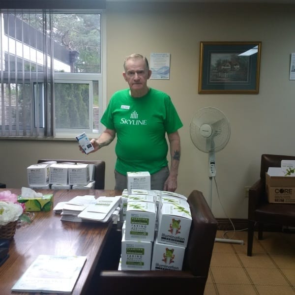 Patrick, Resident Manager at 202 Hespeler, prepares to replace light bulbs