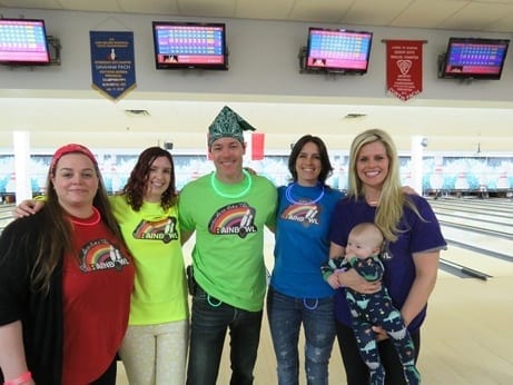 Skyline employees dress up in rainbow shirts for theme bowling
