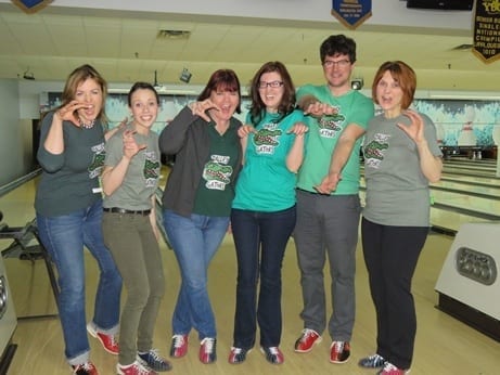 Skyline employees dress up in alligator shirts for theme bowling