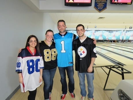 Skyline employees dress up in football jerseys for theme bowling