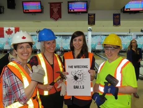 Skyline employees dress up as construction workers for theme bowling