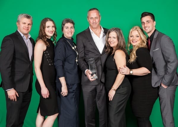 Executives pose with the Environmental Award