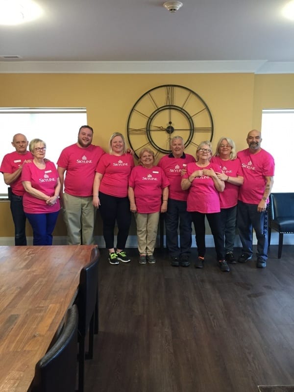 Nine Skyline staff in Ontario wear pink shirts