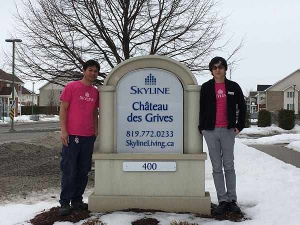 Two Skyline staff in Quebec wear pink shirts