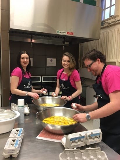 Three Skyliners crack 15 dozen eggs to prepare breakfast for 120 people