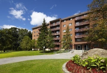 Six storey apartment building. A view from the garden.