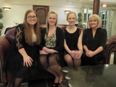 Four Skyliners pose for a group shot at the gala