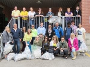 Skyliners pose with collected garbage from downtown