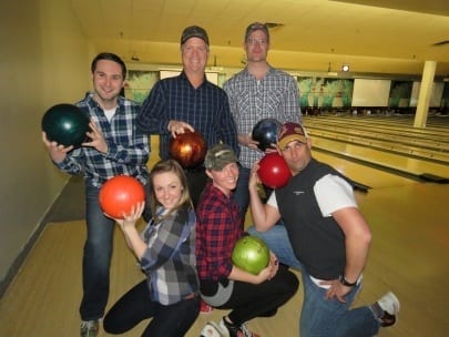 Six Skyline employees dress in lumberjack outfits for theme bowling