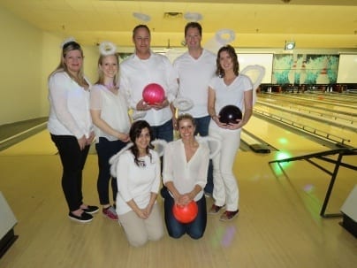 Six Skyline employees dress in angel outfits for theme bowling