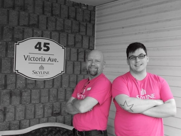 Two building staff members at 45 Victoria Avenue wear pink shirts