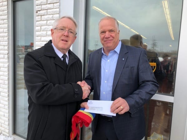 Retail REIT President Gord Driedger shakes hands with Salvation Army