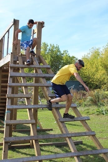 Two Skyliners go down a wooden ladder