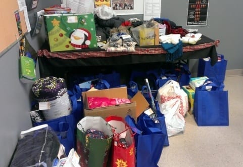 Table full of gifts for adopt-a-family