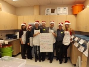 Seven Skyliners pose after making breakfast for students