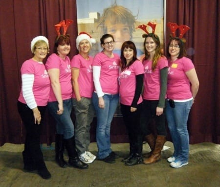 Seven Skyliners pose with Christmas hats and reindeer ears