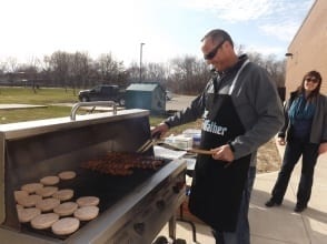 R. Jason Ashdown barbecues on a large commercial sized grill