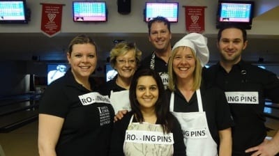 Six Skyliners dress in aprons for theme charity bowling