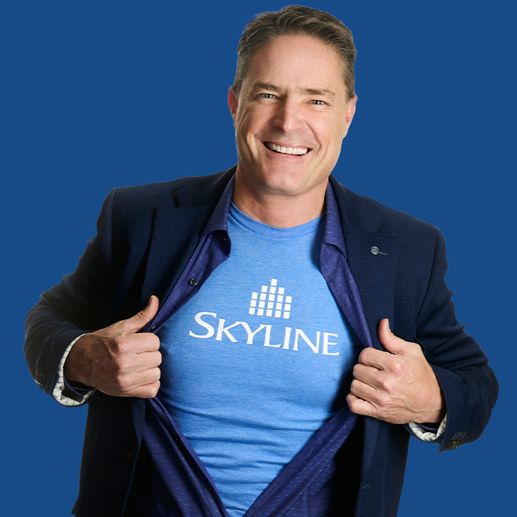 Jason Castellan opening his shirt and jacket to reveal a skyline t-shirt.